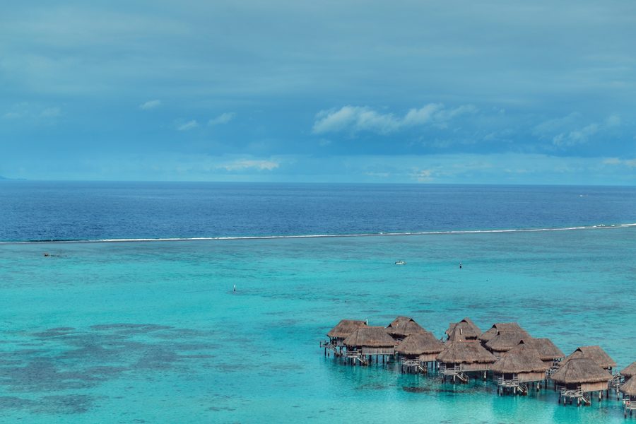 Blue lagoon with overwater lodging structures